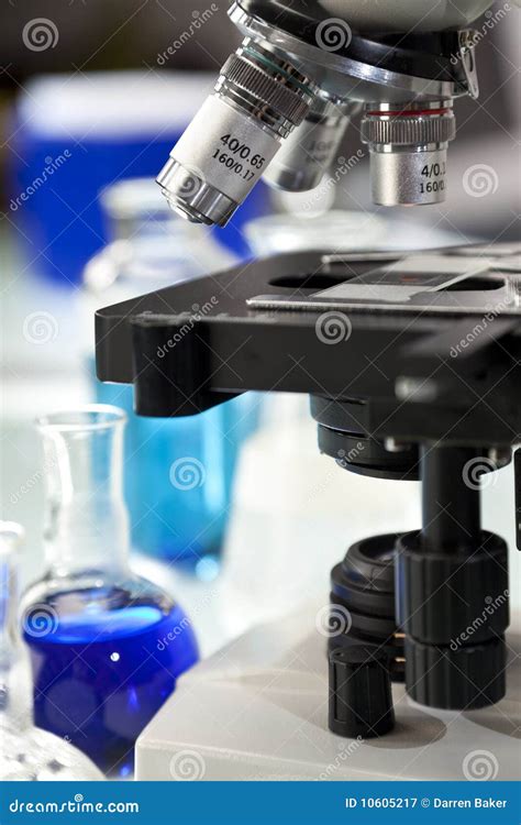 Microscope In A Science Laboratory With Flasks Stock Image Image Of