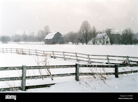 Old Barn And Farmhouse In Snowstorm Stock Photo Alamy