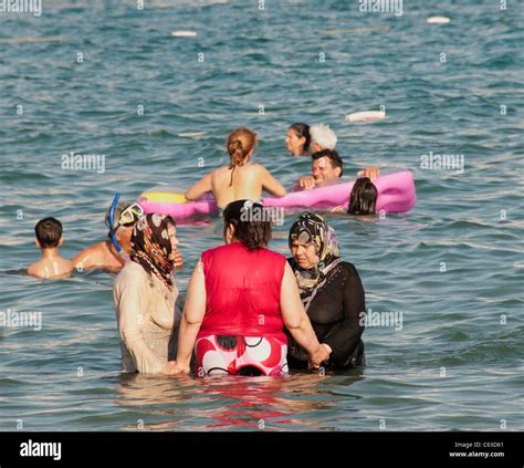 Arabic Muslim Woman Women Swimming Fully Clothed Dressed In