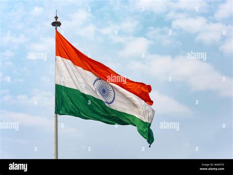 Big Indian Flag Waving Against Blue Sky In New Delhi India Stock Photo