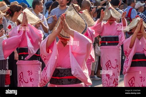 Folk Dancers In Colorful Yukata And Amigasa Straw Hat Dancing In