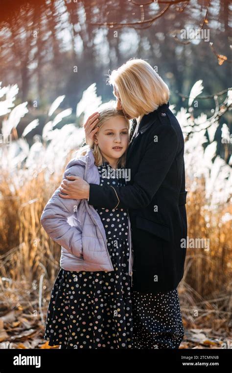 Affectionate Moment Between Mother And Daughter Outdoors A Tender