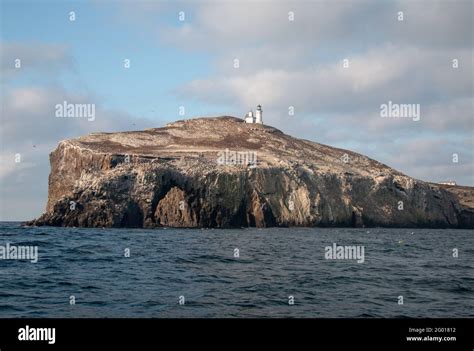 Anacapa Island Arch Rock Formation And Lighthouse In The Channel