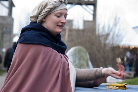 Medieval Girl Playing Knuckle Bones At The Midwinterfair Hans