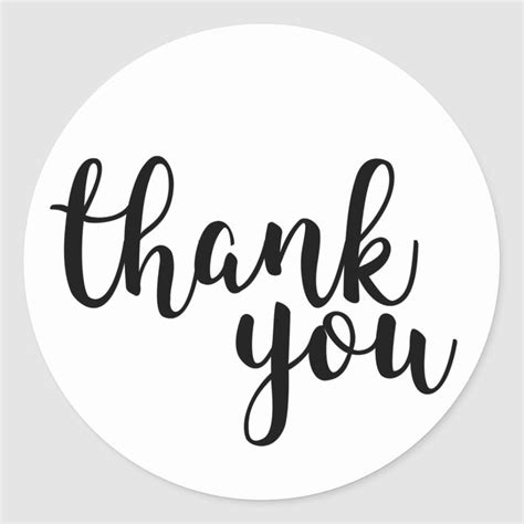 The Words Thank You In Black Ink On A White Round Sticker That Says