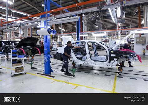 Workers Assembles Cars Image And Photo Free Trial Bigstock