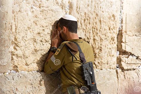 Soldier Praying At The Wailing Wall With Weapon Jerusalem Israel