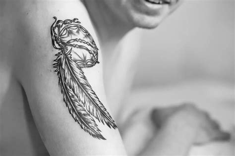 The Symbolism of Feather Tattoos: A Guide to Their Meanings and Interpretations - Inkspired Magazine