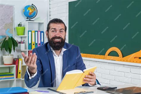 Premium Photo Looking Interested Brutal Man Work In Classroom With