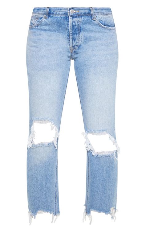 Mid Wash Low Rise Distressed Knee Rip Jeans Prettylittlething