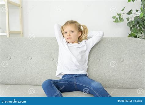 Blond Girl Sit On Sofa At Home Stock Photo Image Of Indoors Leisure