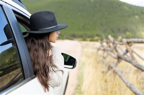 Premium Photo Girl On A Roadtrip Looking Out The Passenger Side Window