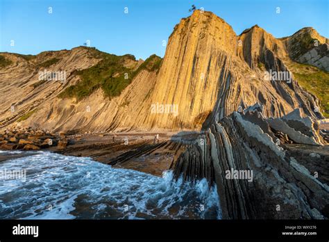 Flysch Itzurun Beach A Sequence Of Sedimentary Rock Layers At Sunset