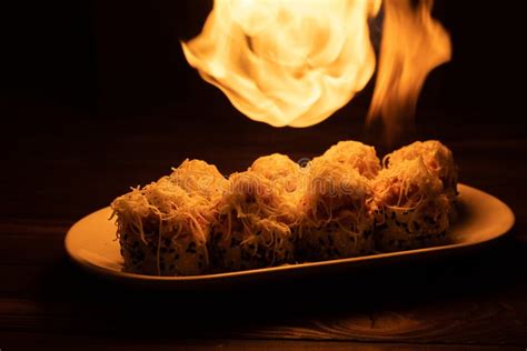 Flaming The Sushi With A Torch In Sushi Bar Japanese Food Concept