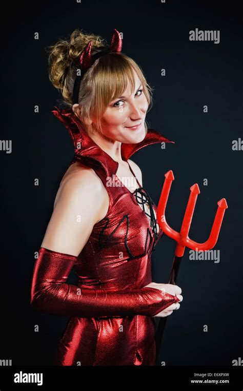 Red Devil Woman With Trident On Black Background Stock Photo Alamy