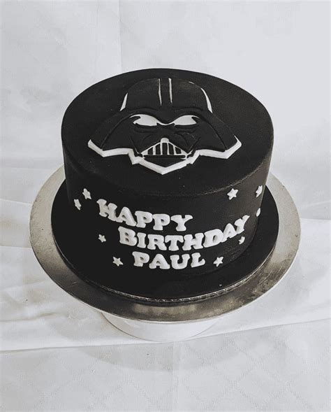 A Star Wars Themed Birthday Cake With Darth Vader Face