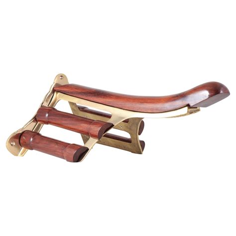 Brass And Wood Saddle Rack In Stable At Schneider Saddlery