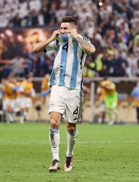 A Man Standing On Top Of A Soccer Field Holding His Hands To His Face