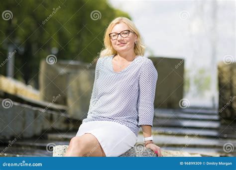 Portrait Of Mature Middle Aged Smiling Blond Woman Wearing Spectacles