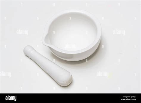 White ceramic mortar and pestle isolated on white background Stock ...