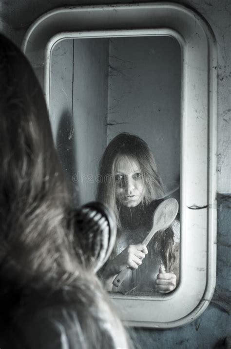 Horror girl in the mirror stock photo. Image of dress - 60753162