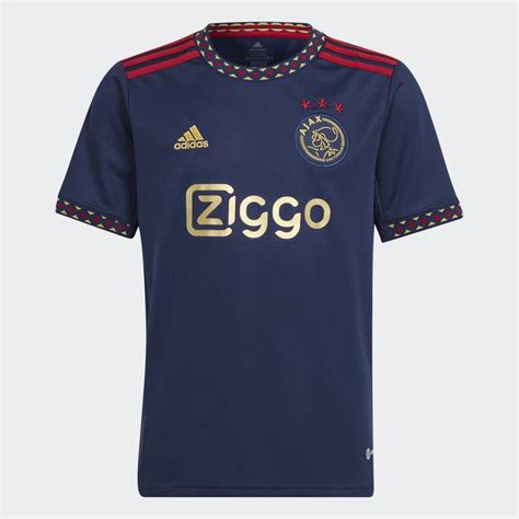 A Soccer Jersey With The Word Ziggo Written On It In Gold Foiling