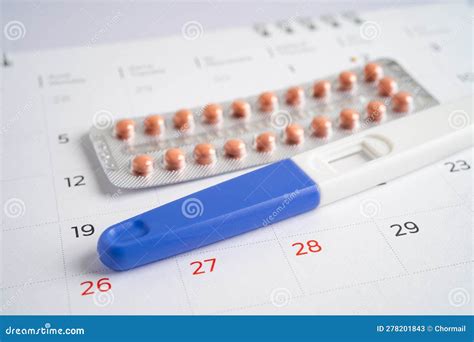 Pregnancy Test And Birth Control Pills On Calendar Contraception Health And Medicine Stock