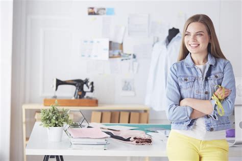 Premium Photo Beautiful Fashion Woman Designer Standing In Studio