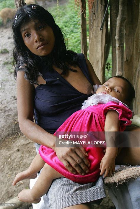 An Indigenous Woman Breastfeeds Her Daughter In The Village Of Piedra