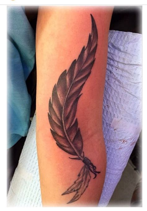 Feather Tattoo Design In Black And Grey On The Forearm Done By Jenny