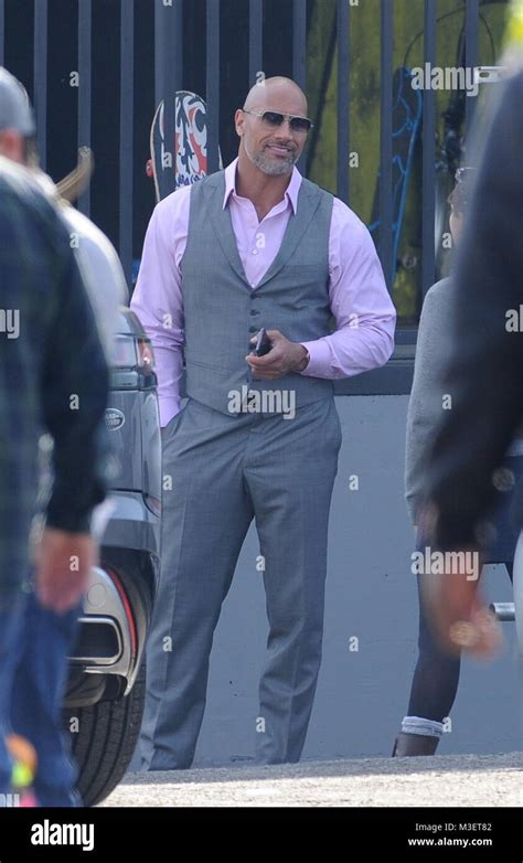 Actor Dwayne Johnson Strikes A Pose While Filming A Scene For The Hit