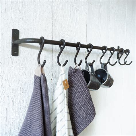 Wand stang met 8 haken GERESERVEERD – Mahieu Wonen