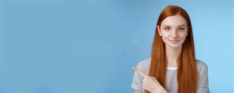 Attractive Modest Good Looking Redhead Girlfriend Acting Mature Friendly Smiling Pointing Left
