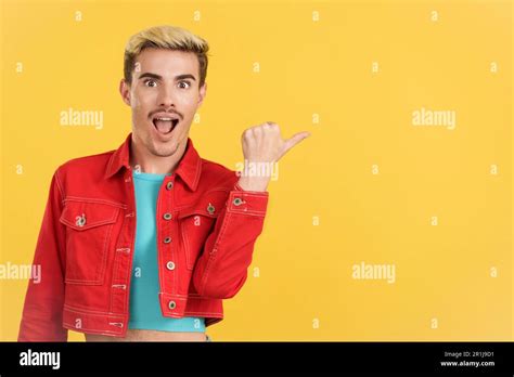 Surprised Gay Man Pointing A Blank Space Aside Stock Photo Alamy