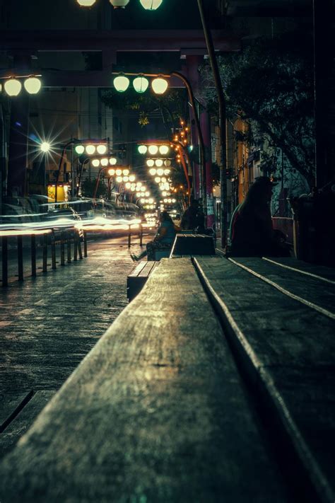 Illuminated city street at dark night time · Free Stock Photo