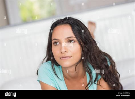 Pretty Brunette Lying On Bed Stock Photo Alamy