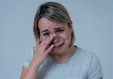 Portrait Of Sad And Depressed Woman Isolated In White Background