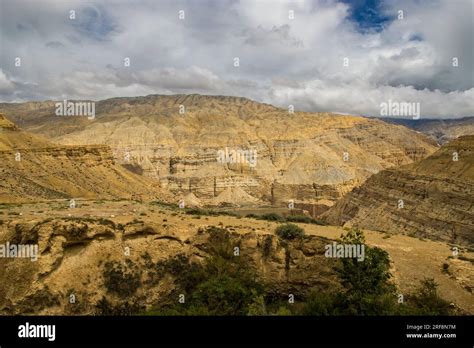 Breathtaking Cloudy Desert Landscape Of Upper Mustang Captured From