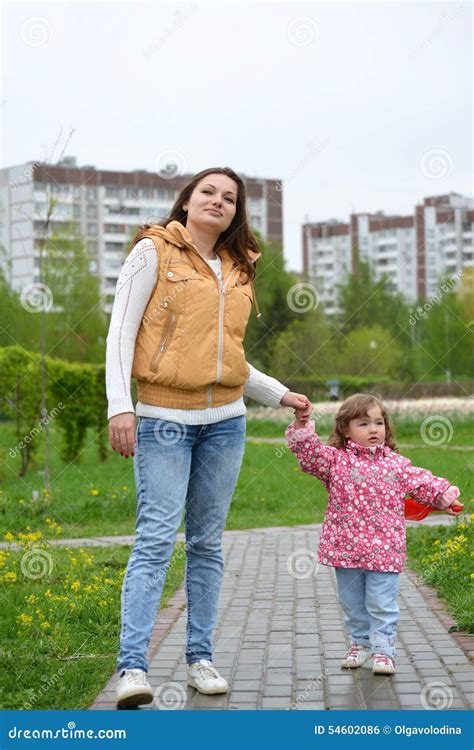 Mother And Daughter Walking Along Path Stock Photo Image Of American