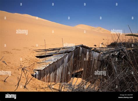 Sand Dune Pushing Over Derelict Building Sandwich Harbour Namib