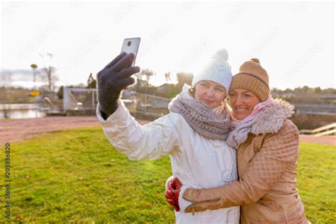 Two Mature Beautiful Women Together Against Scenic View Of Natur Stock Photo Adobe Stock
