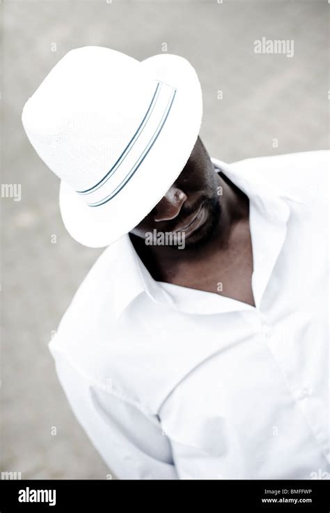 Black Man Wearing White Hat Looking Down Stock Photo Alamy