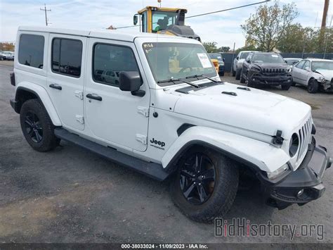 Report 1C4HJXEG4MW609870 JEEP WRANGLER UNLIMITED 2021 White Gasoline