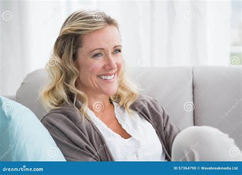 Pretty Day Dreaming Blonde Sitting On The Couch Stock Photo Image Of Life Cheerful