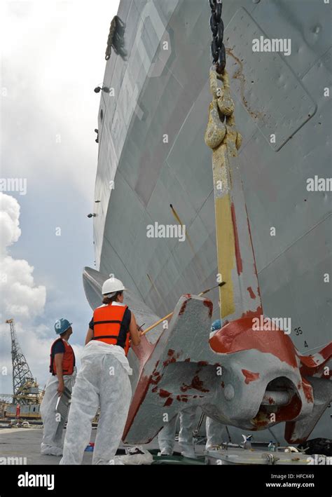 Sailors Assigned To The Submarine Tender Uss Frank Cable As Paint