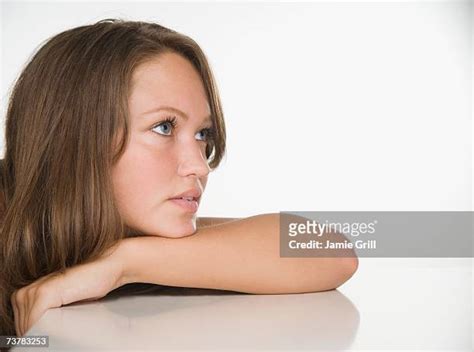 Young Woman Leaning On Her Elbows Photos And Premium High Res Pictures