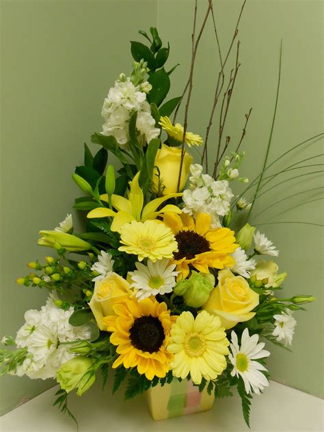 A Beautiful Arrangement Designed With Sunflowers Gerbera Daisies