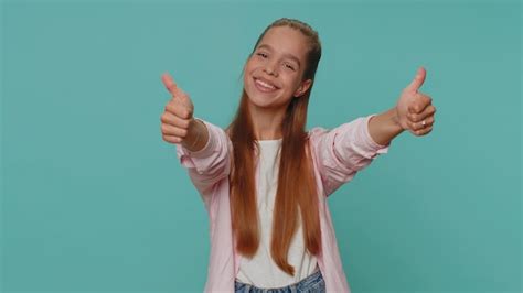 Premium Photo Girl Raises Thumbs Up Agrees Or Gives Positive Reply