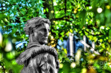 Mountaineer statue in trees Photograph by Dan Friend | Fine Art America