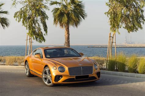rent bentley continental gt gold  dubai sportscars octane car